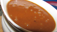 reduced cooking liquid made into cheddar sauce