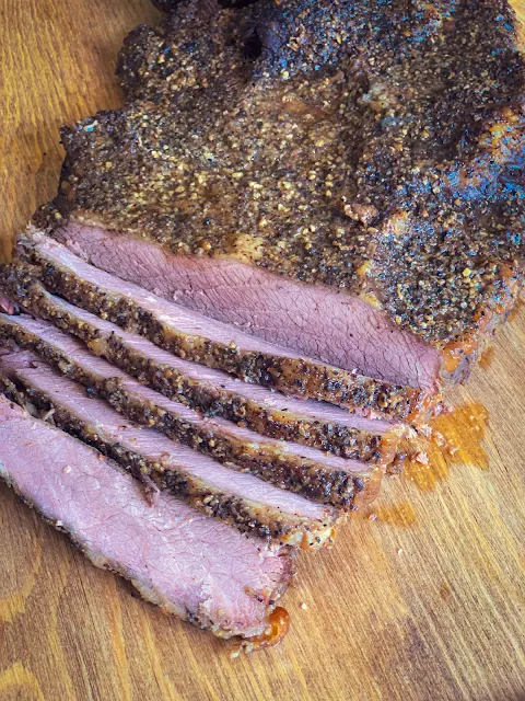 Oven Smoked Brisket is tender meat that tastes like it has been smoked in a smoker for hours.  You don't need a smoker to enjoy this mouthwatering oven smoked brisket.