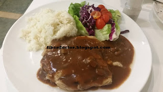 Herb rice and salad and grilled chicken with black pepper sauce