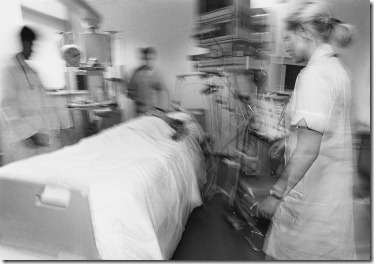 Medical Staff Tending a Patient ca. 1980s-1990s