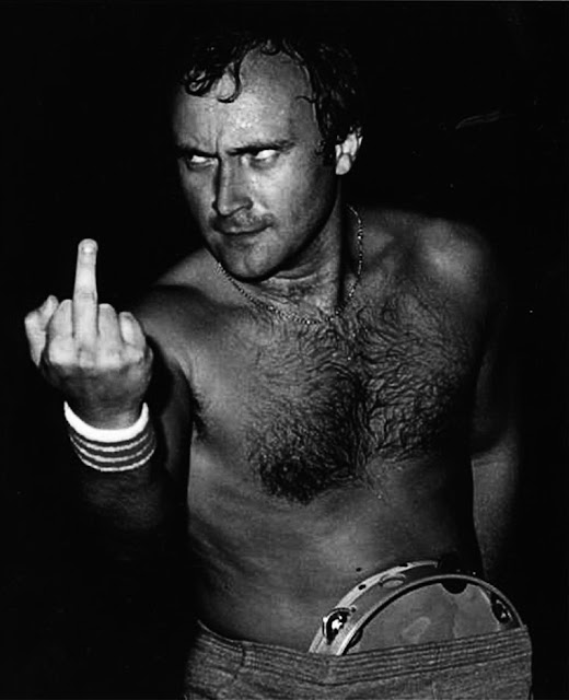Phil Collins giving the finger