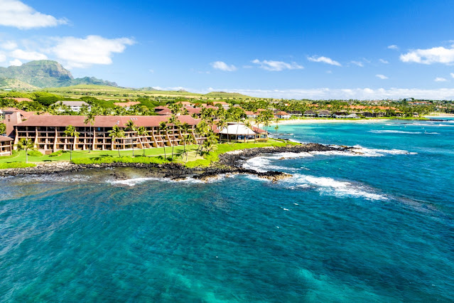Escape to Sheraton Kauai Resort, a stunning oceanfront hotel offering modern accommodations and amenities directly on the shores of Hawaii's Poipu Beach.