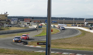 RACE CARS TAKING A CORNER