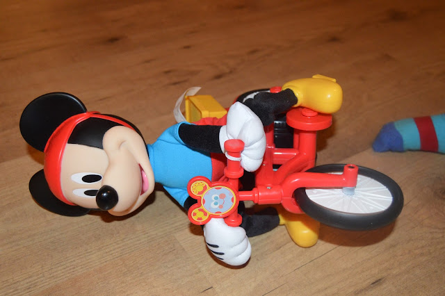 Fisher-Price Silly Wheelie Mickey lying on floor after falling over