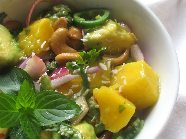 avocado mango salad amongst cashews