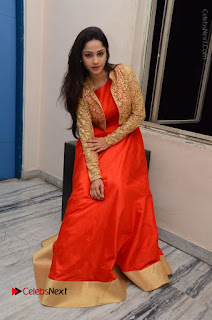Telugu Actress Divya Nandini Stills in Orange Sleeveless Gown at Chennai Chaitrama Movie le Launch Event  0117.JPG
