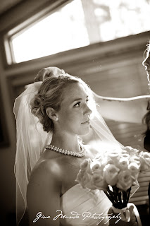 Bride with yellow roses, veil, and pearls