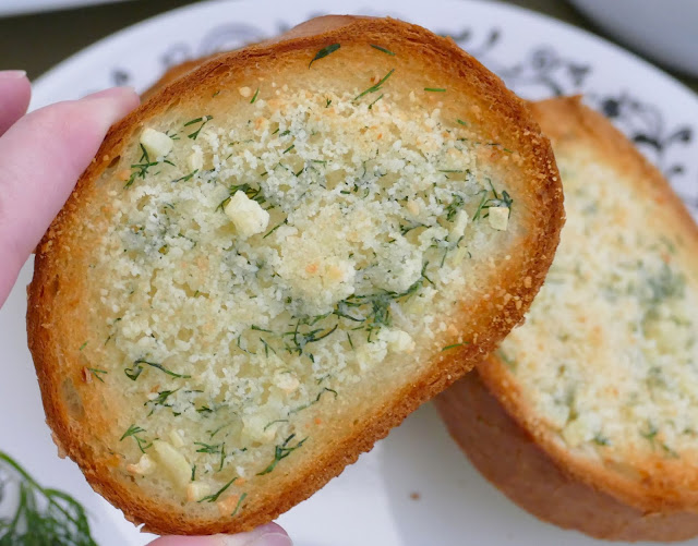 This delicious garlic bread is such a great addition to any meal. The grated parmesan cheese and fresh dill adds a unique pop of flavor to the buttery french bread slices! Easy and ready in less than 15 minutes!