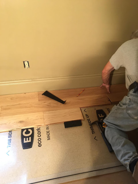 Starting putting the flooring down.