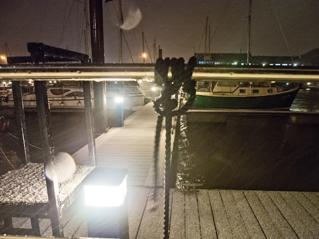 Photo of snow being blown around by high winds as it starts to settle on the pontoons