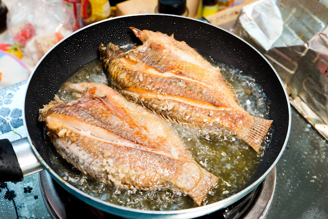 Frying fish in a non stick pan.