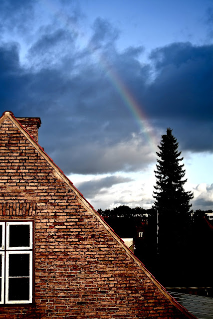 Rainbow on a beautiful blue sky over Copenhagen (København) taken from Hellerup. Rainbow at the same time as sunlight.