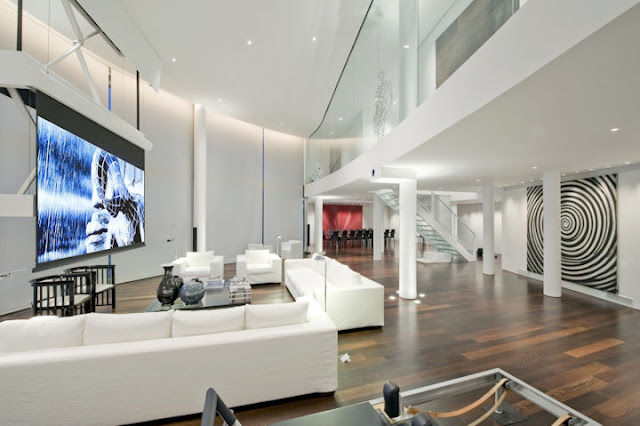 Picture of the London penthouse living room during the movie time with the white curtains on the large windows