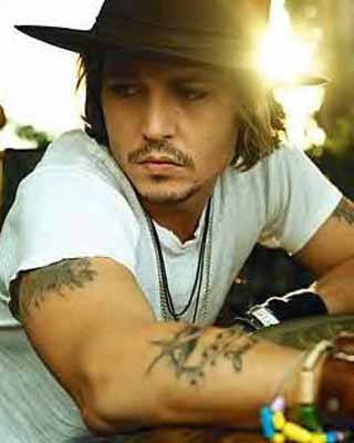 Johnny Depp with Star tattoo on arm Johnny Depp with Star tattoo on arm