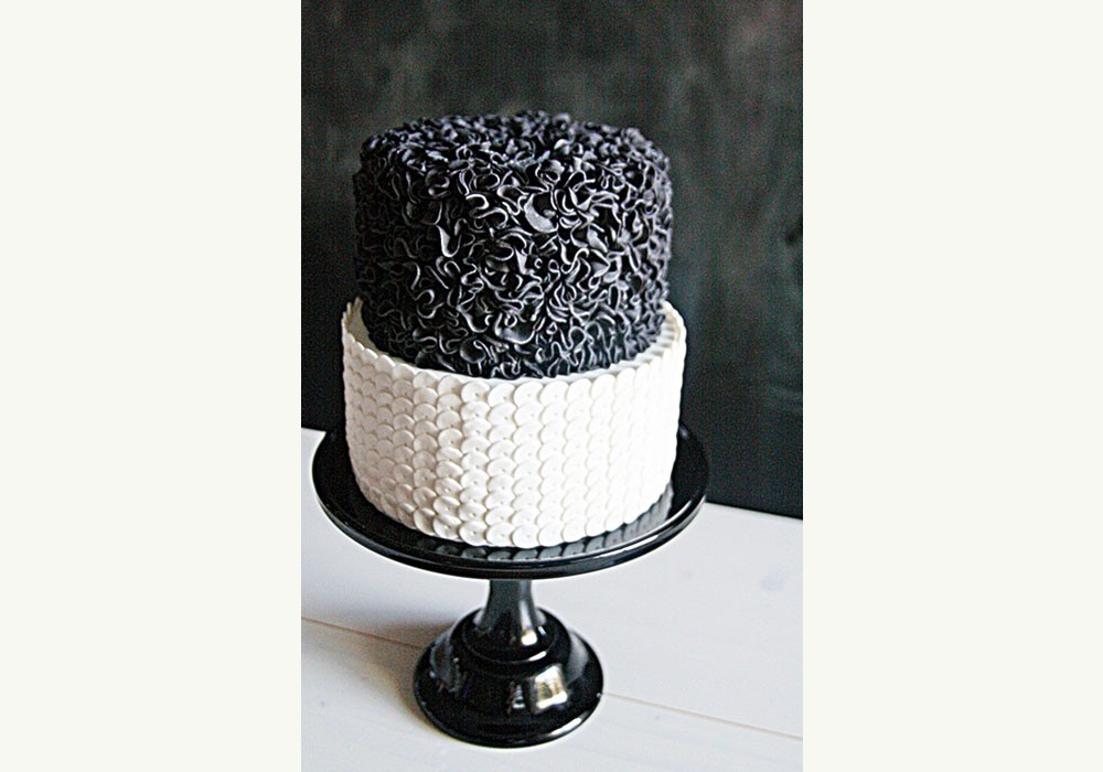 A very chic two tier black and white wedding cake from Sweet Bloom Cakes