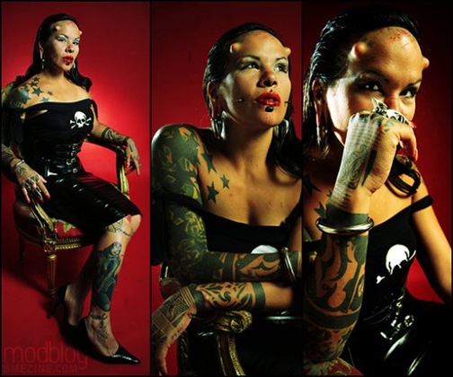 Modified Madam La Negra with horns, tattoos, scarification, piercings and a 