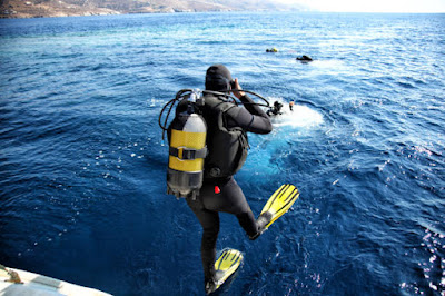 scuba divers in sea