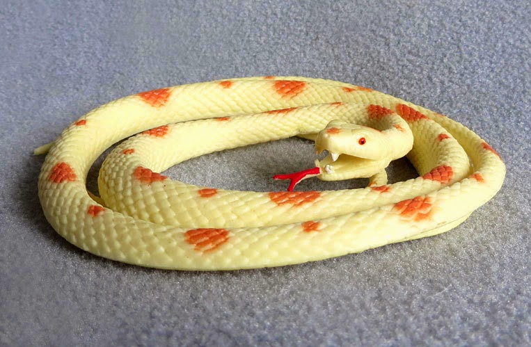 Toy Cream and Orange-Colored Snake