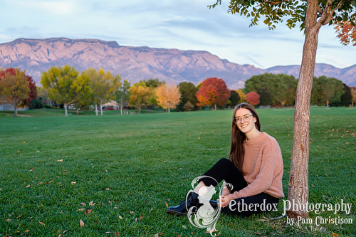 Professional photo of a high school senior girl in a park location Albuquerque