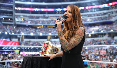 Lita with the WWE Women's Championship belt