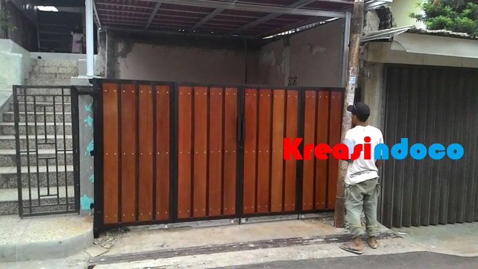 Pemasangan Pintu Besi Kombinasi Kayu Kamper di Jerokuta 