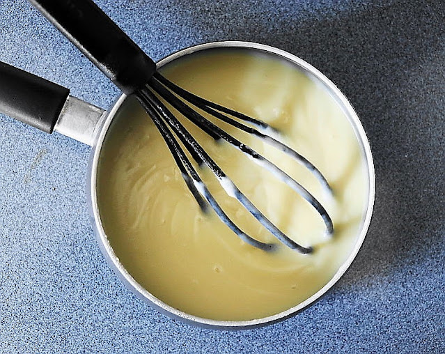 Whisking Homemade Vanilla Pudding Image