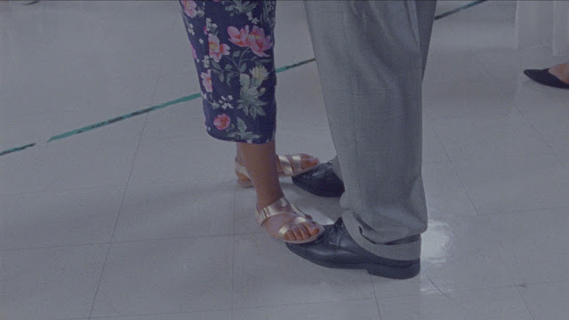 A girl dance on her father's feet