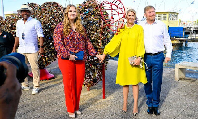 Princess Amalia wore a new Kiledia floral print silk blouse by Isabel Marant Etoile. Queen Maxima wore a yellow silk dress by Natan
