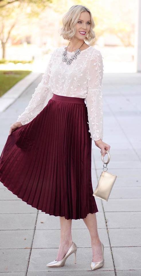 a midi maroon skirt that has already mastered the whole flirty peek-a-boo scene
