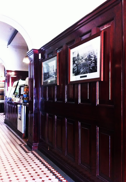 Photo taken inside Brother Espresso in the wood panelled vestibule of Wickham House.