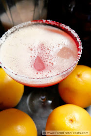 A recipe for a seasonal winter holiday cocktail--fresh grapefruit blended in a margarita and finished with a splash of pomegranate juice.