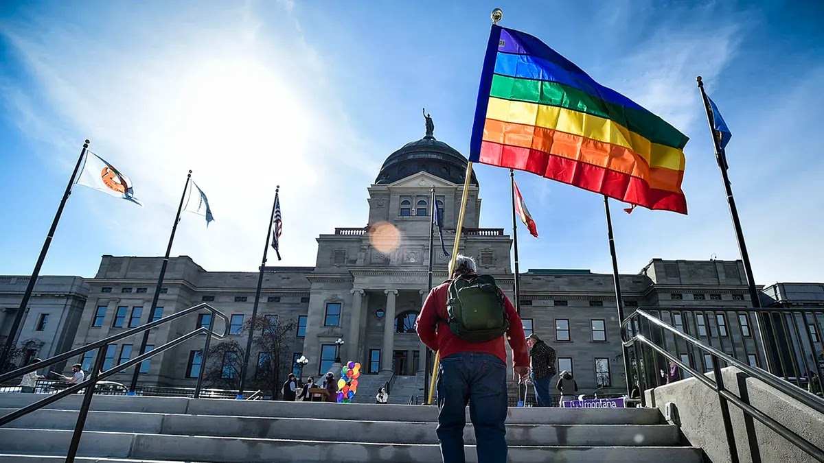 Demonstrators gather on the steps of the Montana State Capitol protesting anti-LGBTQ+ legislation on March 15, 2021, in Helena, Mont.  ((Thom Bridge/Independent Record via AP, File))