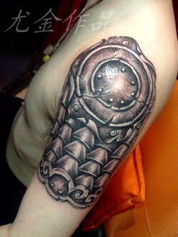 an arm armor tattoo