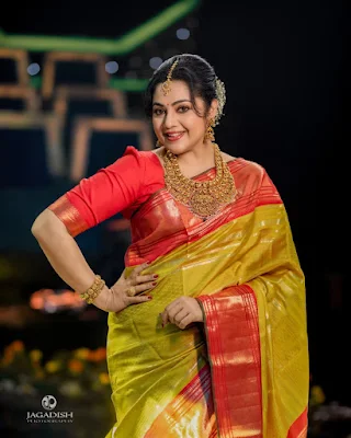 Actress Meena in a stunning traditional saree showcasing timeless elegance and grace