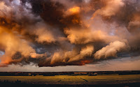 Storm Clouds over field - Photo by Marek Piwnicki on Unsplash