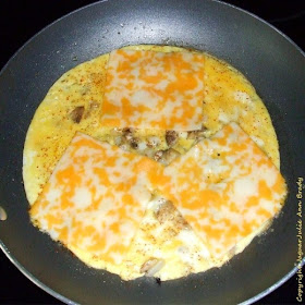 step one Easy Cheesy Omelet with Mushrooms and Onions