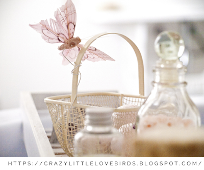 One basket with a butterfly decoration and bath essentials