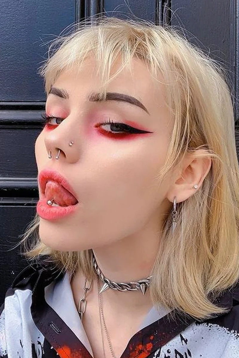 close-up selfie of a beautiful woman with reg goth makeup look