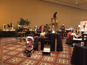 Coco, the Cornish Rex, checking out the Cat Style Lounge at BlogPaws