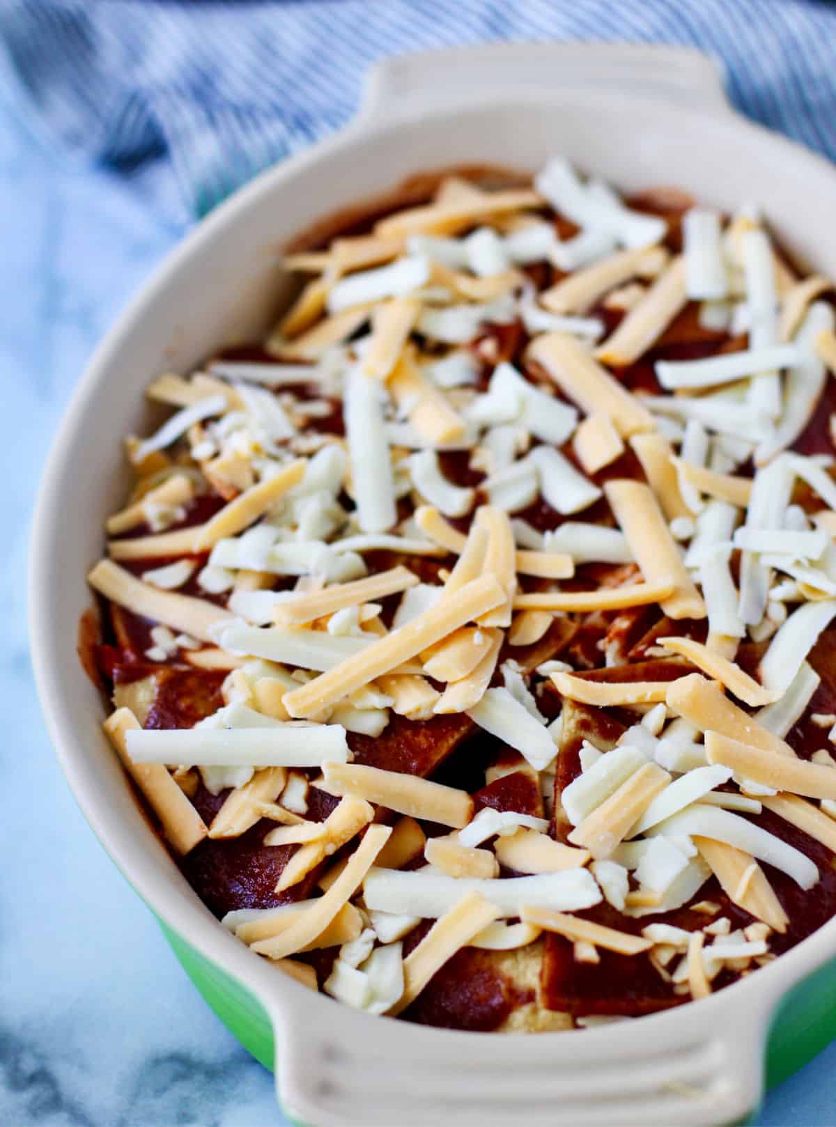 Easy Chicken Enchilada Casserole assembled before baking.