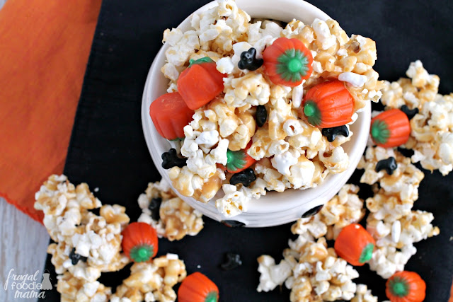 Candy pumpkins and ghost shaped sprinkles are tossed with peanut butter coated popcorn in this irresistible Haunted Pumpkin Patch Popcorn Crunch.