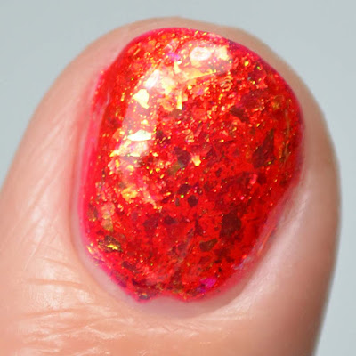 red flakie nail polish close up swatch