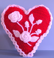 http://www.ravelry.com/patterns/library/hearts-and-flowers-valentine-pillow