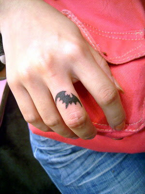 little bat tattoo, on your index finger