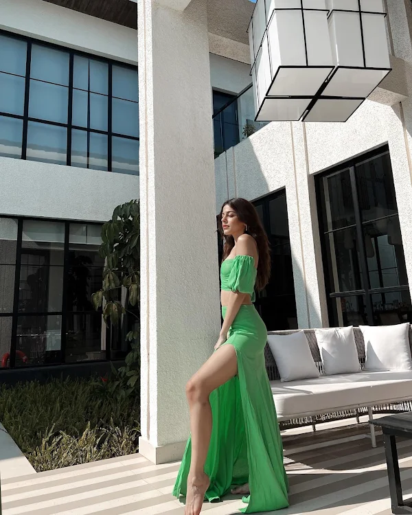 Alaya F high slit green outfit sexy legs
