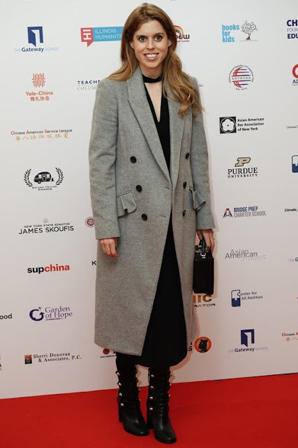 Princess Beatrice wore a gray wool and cashmere trentwood double breasted coat by Burberry. Isabel Marant Arnie Blsck leather boots