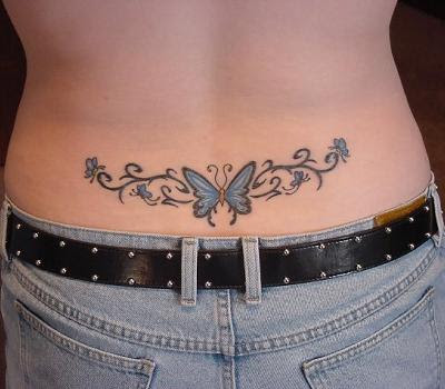 lower back flower tattoos. butterfly and flower tattoo.