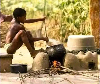 A young guy preparing his hometown food-akple.
