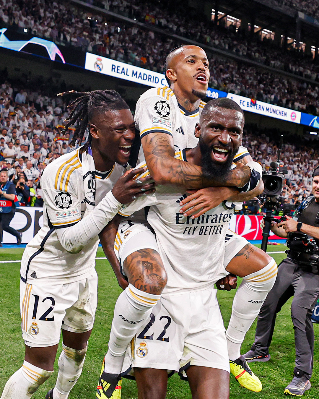 Real Madrid players take a shot in celebration of their progress into the final of the Uefa Champions League 2023/24 following their triumph over Bayern Munich in the semi final
