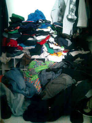 T-shirts on the floor of a closet